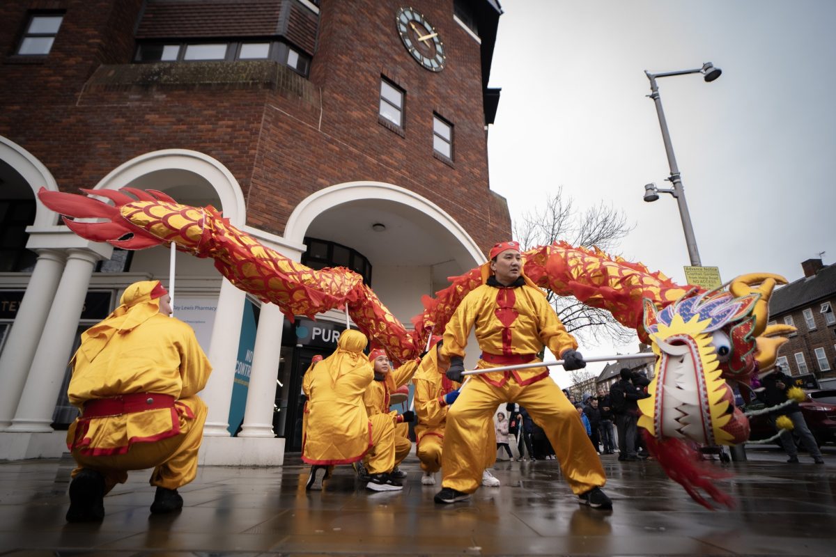 Dragon Dance Performers at a Town Parade. 